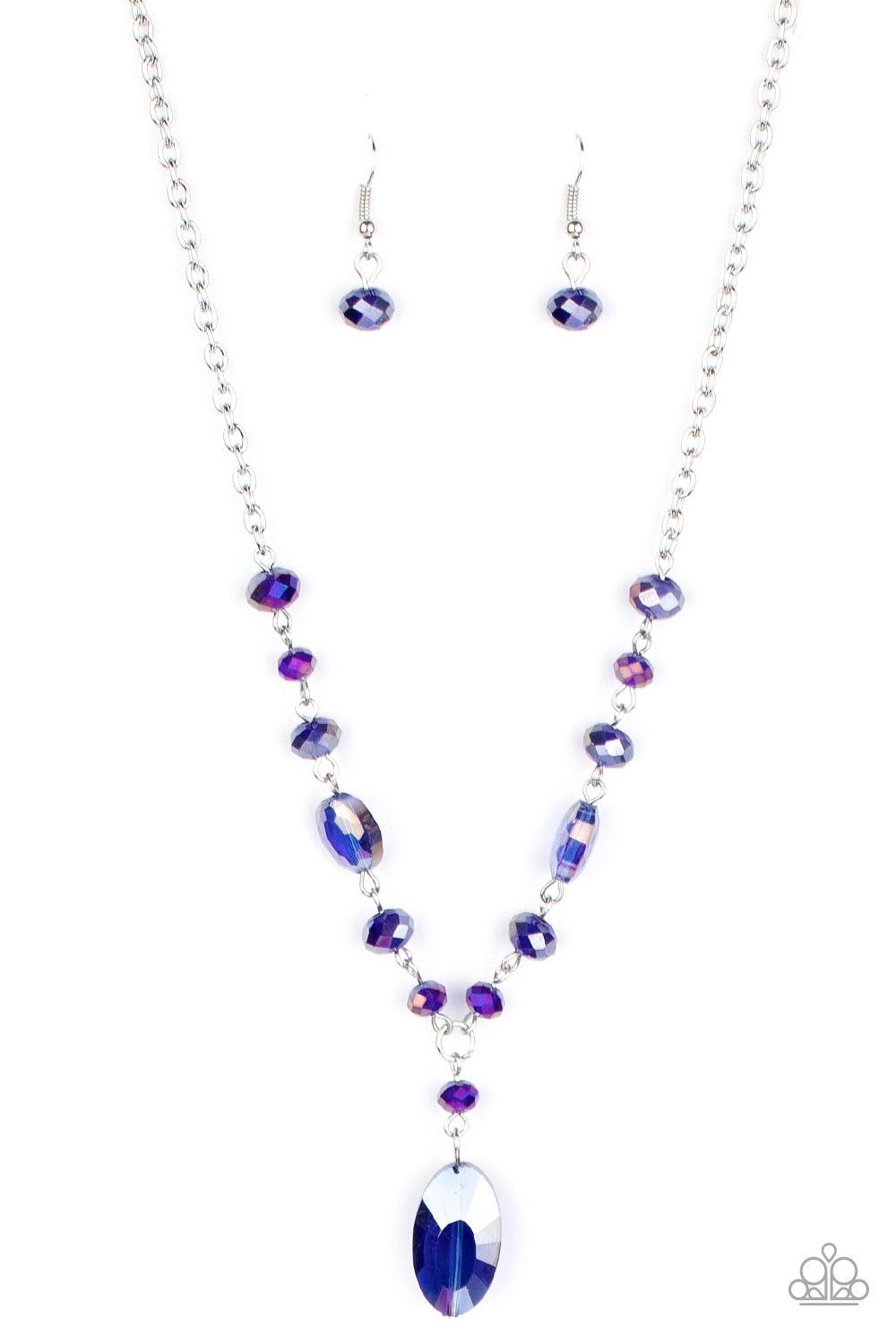 Paparazzi Accessories Fashionista Week - Blue Featuring an iridescent shimmer, an oval blue crystal-like bead swings from the bottom of a matching crystal-beaded chain, creating an elegantly extended pendant below the collar. Features an adjustable clasp