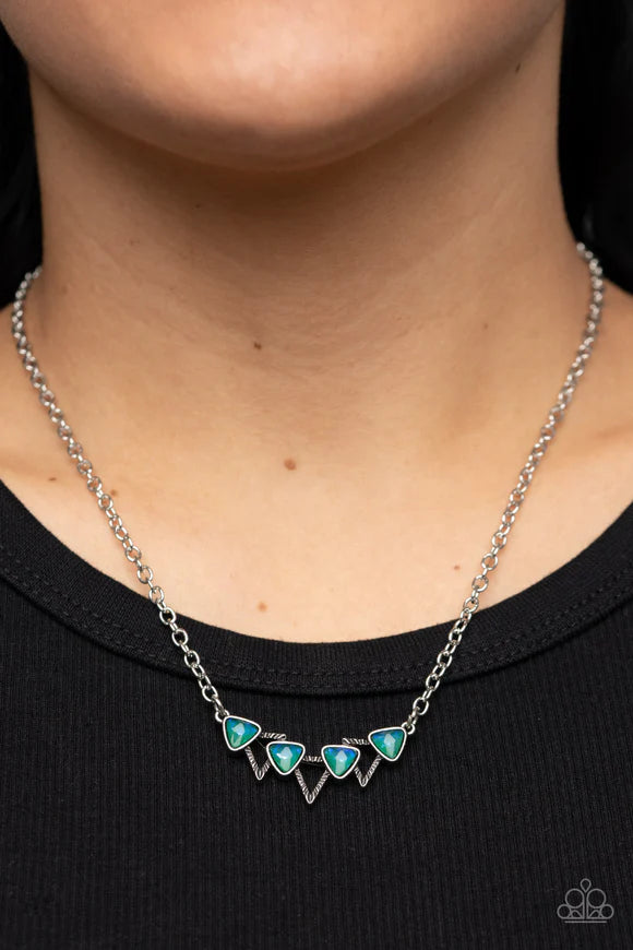 Paparazzi Accessories Pyramid Prowl - Multi A staggered row of iridescent triangular gems stack across the front of a row of textured silver triangular frames, resulting in a stellar sparkle below the collar. Features an adjustable clasp closure. Sold as