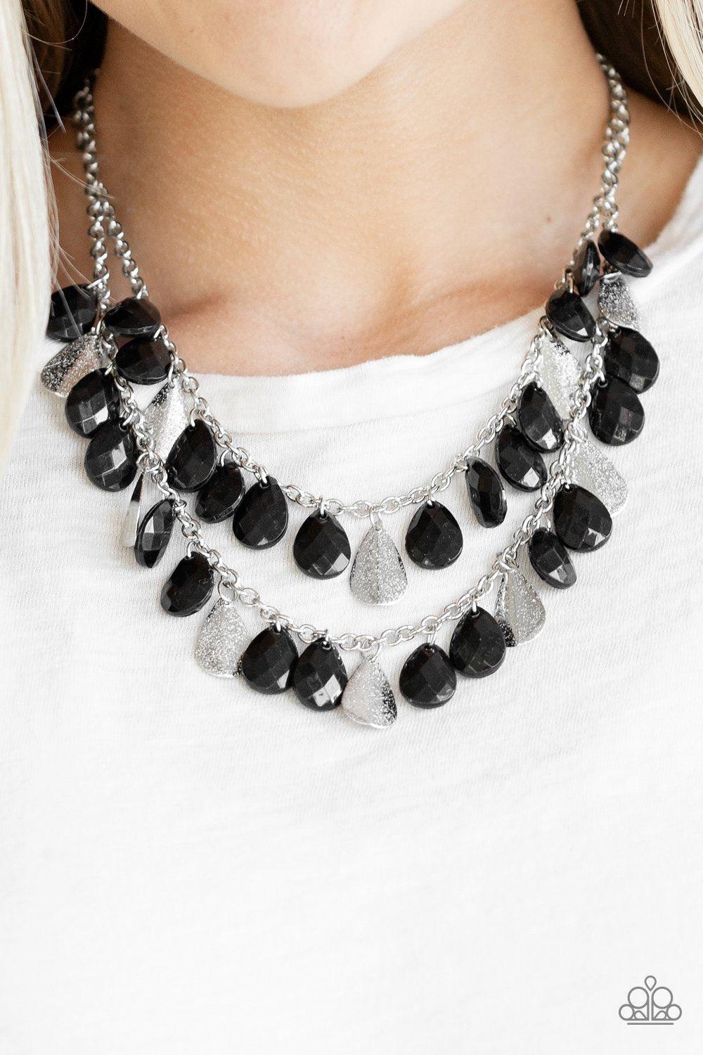 Paparazzi Accessories Life of the FIESTA - Black Two strands of silver chain are decorated in a flirtatious fringe of faceted black teardrops. Glittery beveled silver teardrops are sprinkled between the black beading, adding hints of shimmer to the vibran