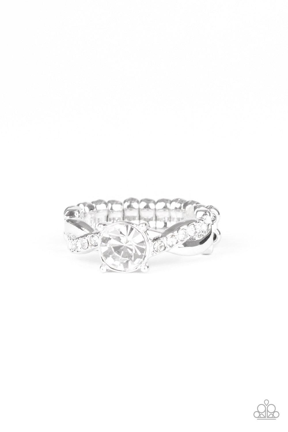 Paparazzi Accessories Prim And Proper - White A plain silver and white rhinestone encrusted silver band delicately braid across the finger. A classic white rhinestone adorns the center, creating a timeless centerpiece. Features a dainty stretchy band for
