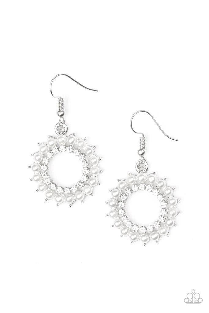 Paparazzi Accessories Wreathed in Radiance - White Dainty white pearls spin around a radiant white rhinestone center, coalescing into a refined hoop. Earring attaches to a standard fishhook fitting. Sold as one pair of earrings. Jewelry