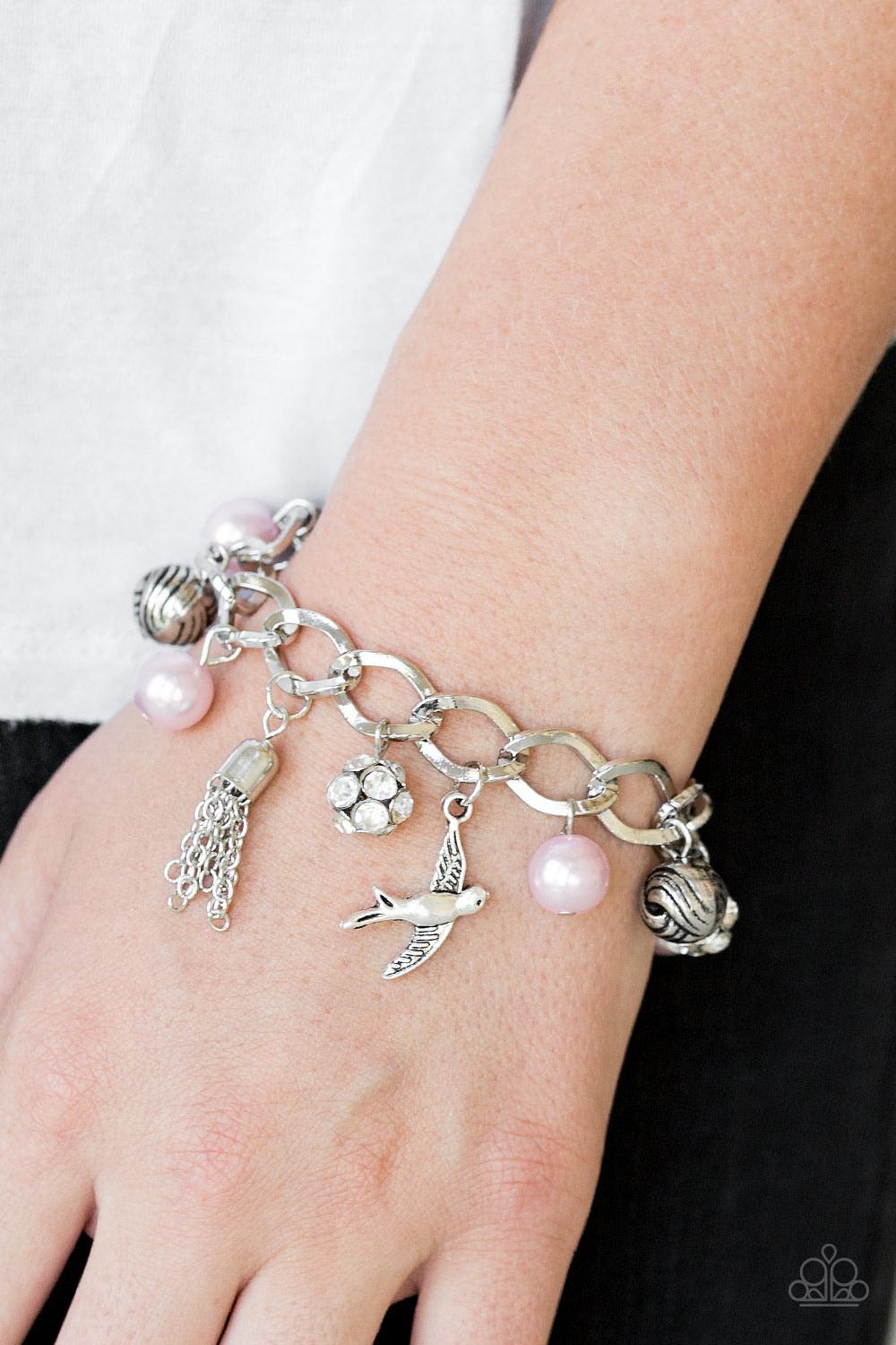 Paparazzi Accessories Lady Love Dove - Pink Pink pearls, ornate silver beads, and white rhinestone encrusted accents swing from a dramatic silver chain. A shimmery silver bird charm and silver tassel are added to the display, creating a whimsical fringe a