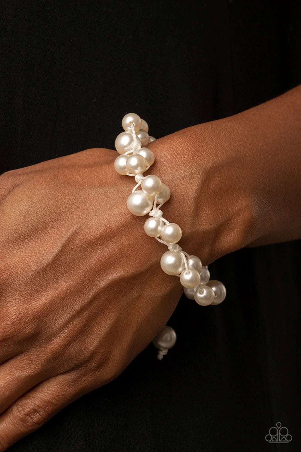 Paparazzi Accessories Vintage Versatility - White Bubbly clusters of white pearls are decoratively knotted around the wrist, adding a timeless twist to the elegant centerpiece. Features an adjustable sliding knot closure. Sold as one individual bracelet.