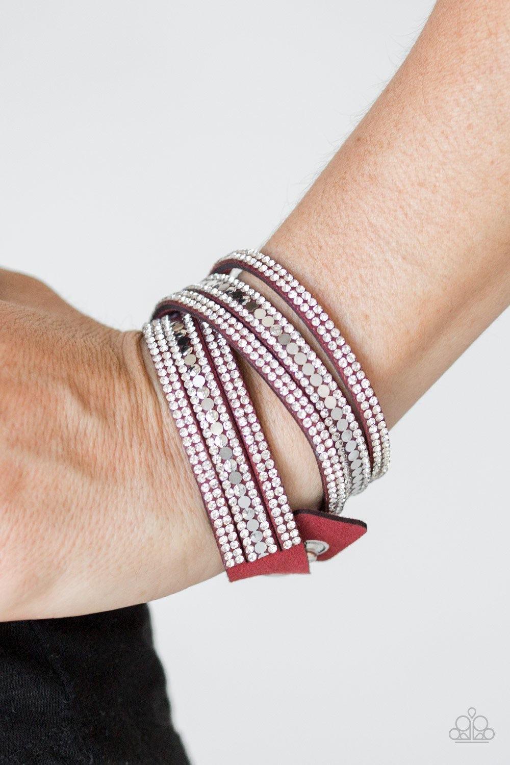 Paparazzi Accessories Rock Star Attitude - Red Encrusted in rows of glassy white rhinestones and flat silver studs, three strands of red suede wrap around the wrist for a sassy look. The elongated band allows for a trendy double wrap around the wrist. Fea