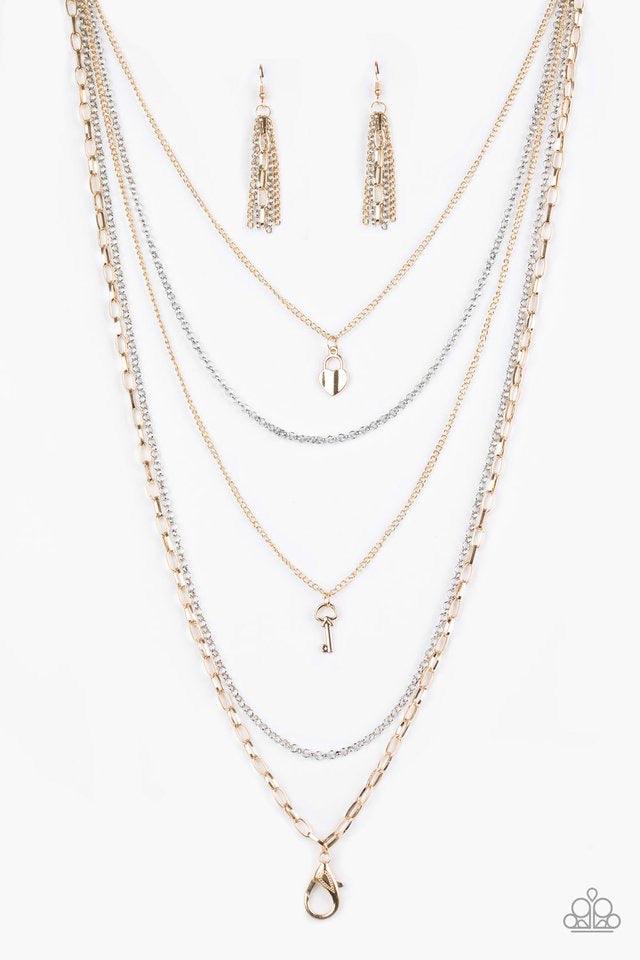 Paparazzi Accessories Right On Key - Multi *Lanyard Layers of gold and silver chain fall together to create the illusion of five separate necklaces. Each gold chain is adorned with a small gold charm, including a heart and a key. A lobster clasp hangs fro