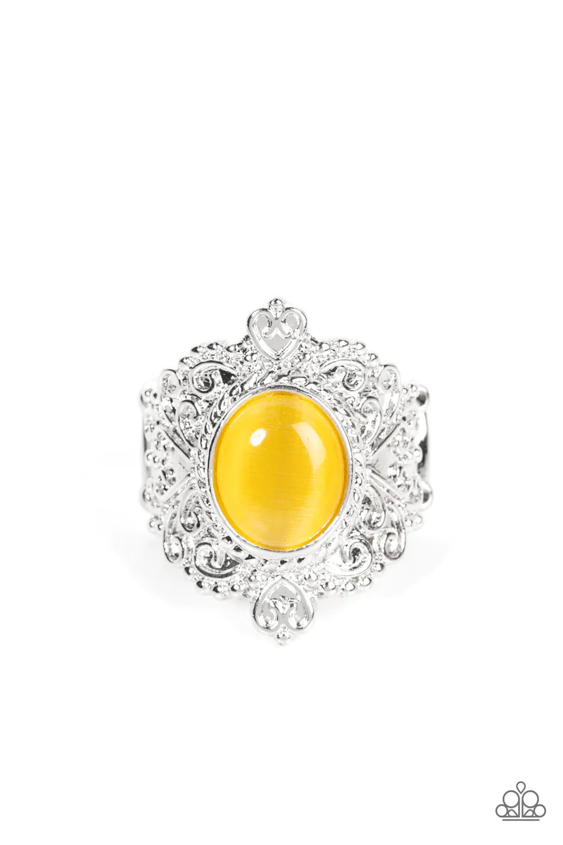 Paparazzi Accessories Delightfully Dreamy - Yellow Embossed in an enchanting heart motif, a frilly silver frame is adorned with a dreamy yellow cat's eye stone center for a magical pop of color atop the finger. Features a stretchy band for a flexible fit.