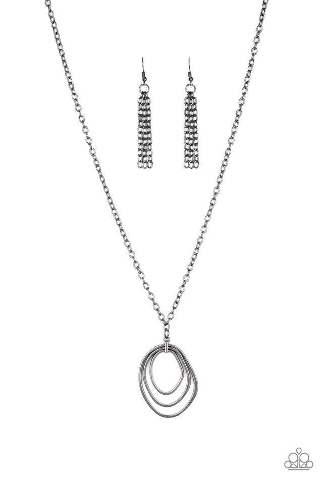 Paparazzi Accessories Relic Redux - Black Asymmetrical gunmetal hoops join into an abstract pendant at the bottom of a lengthened gunmetal chain for an industrial flair. Features an adjustable clasp closure. Jewelry