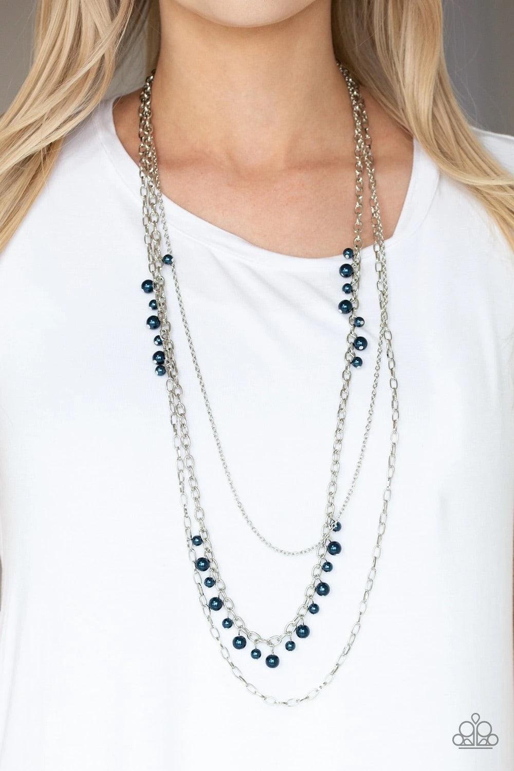 Paparazzi Accessories Pearl Pageant None - Blue Three mismatched silver chains layer down the chest. Dainty blue pearls cascade down one silver chain, adding a flirty twist to the timeless pearl palette. Features an adjustable clasp closure. Sold as one i