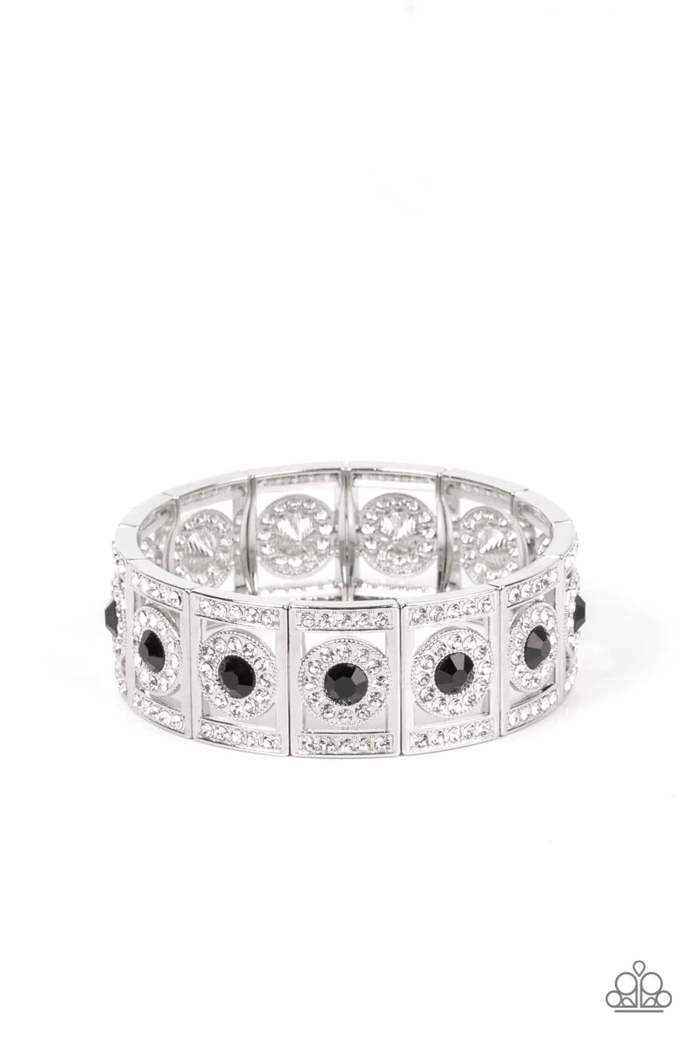 Paparazzi Accessories Ultra Upscale - Black A glassy black rhinestone is pressed into a ring of glitzy white rhinestones inside a rectangular silver frame dusted in dazzling white rhinestones. The timeless frames sparkle along stretchy bands around the wr