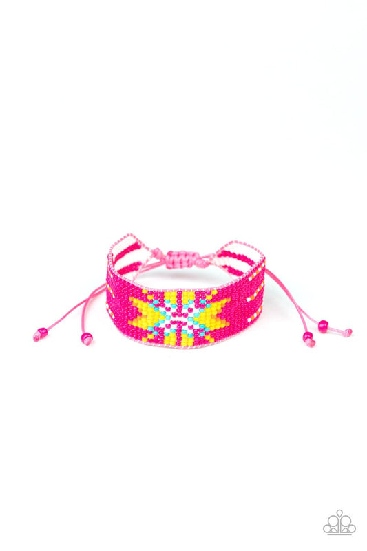 Paparazzi Accessories Beautifully Badlands - Pink Threaded along invisible thread, a dainty collection of pink, white, orange, yellow, and blue seed beads weave into a colorful textile pattern across the wrist for a tribal inspired look. Features an adjus