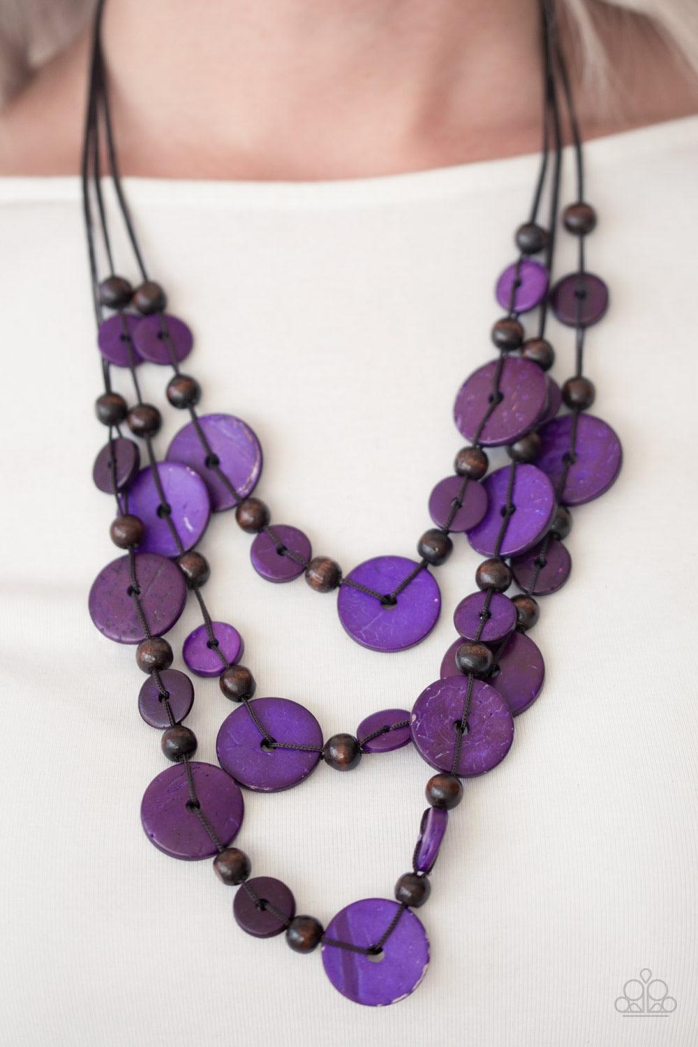 Paparazzi Accessories South Beach Summer - Purple Brushed in a distressed finish, purple and brown wooden beads trickle along three strands, creating a summery look down the chest. Features a button loop closure. Jewelry