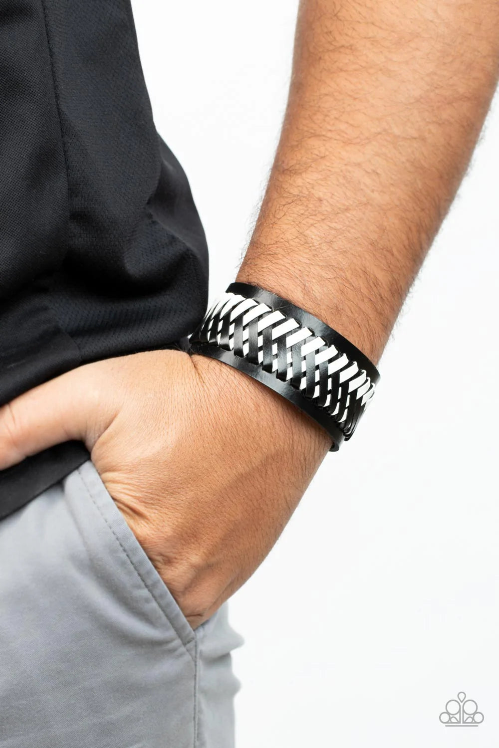 Paparazzi Accessories Punk Rocker Road - Black Black and white leather laces decoratively crisscross across the front of a thick black leather band, resulting in a rebellious pop of color around the wrist. Features an adjustable snap closure. Sold as one