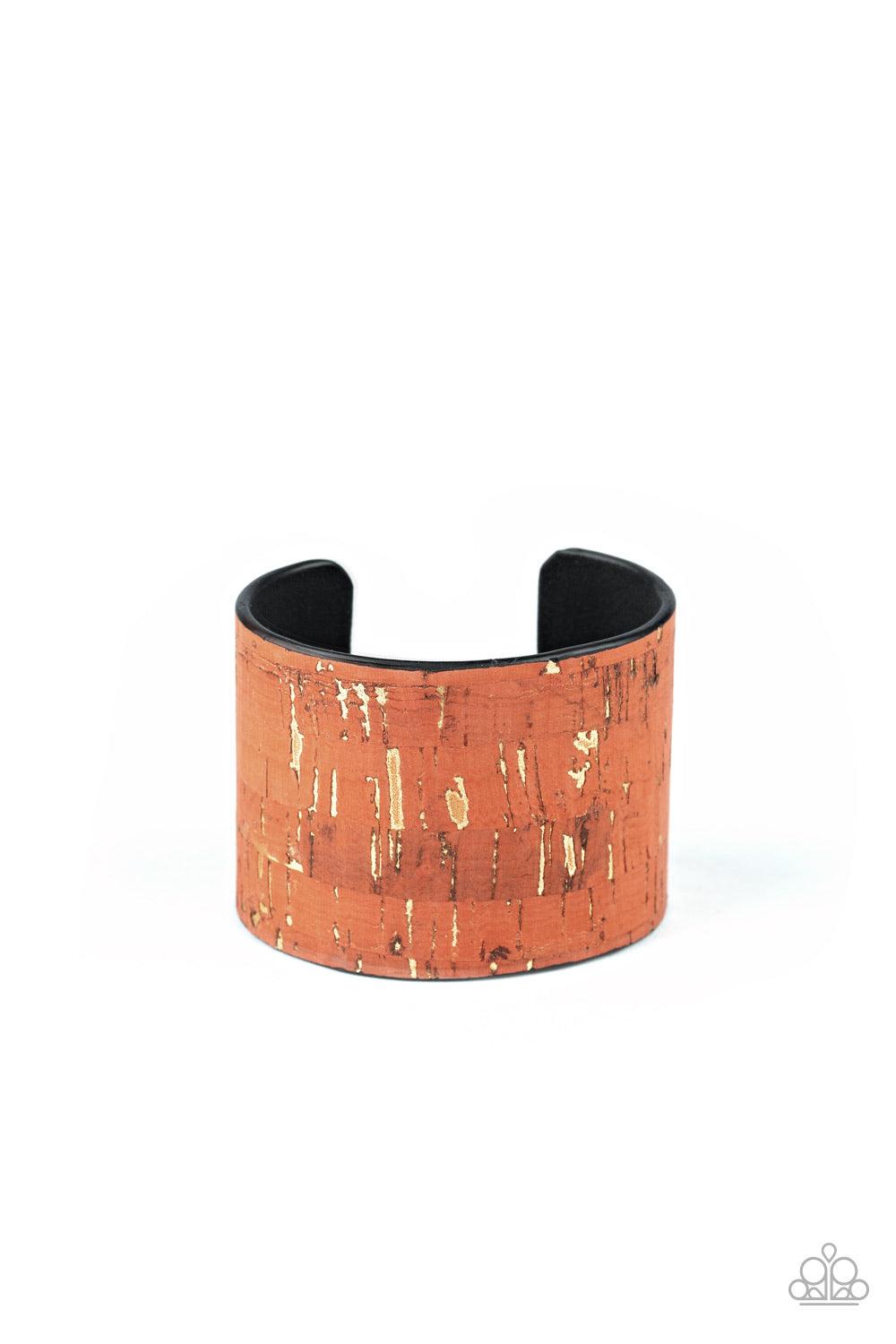 Paparazzi Accessories Up To Scratch - Orange Featuring an orange cork-like finish, a thick cuff is scratched, revealing lines of golden shimmer for a seasonal look. Jewelry