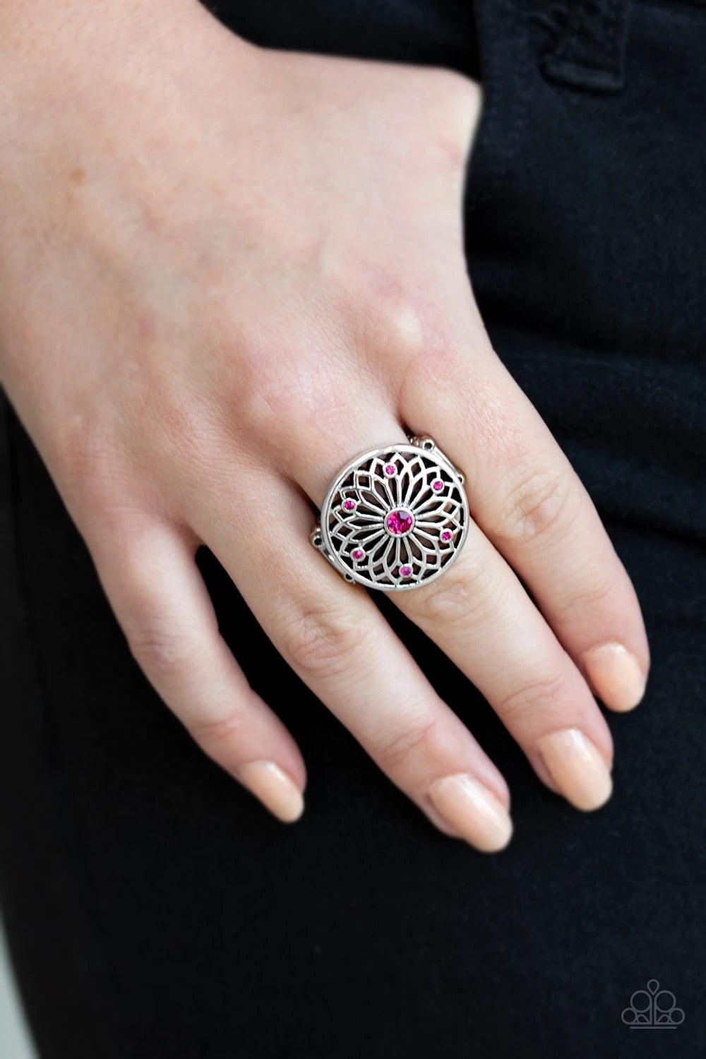 Paparazzi Accessories Mandal Magnificence - Pink Glittery pink rhinestones are sprinkled across a shimmery floral center, creating a whimsical mandala-like frame atop the finger. Features a stretchy band for a flexible fit. Sold as one individual ring. Ri