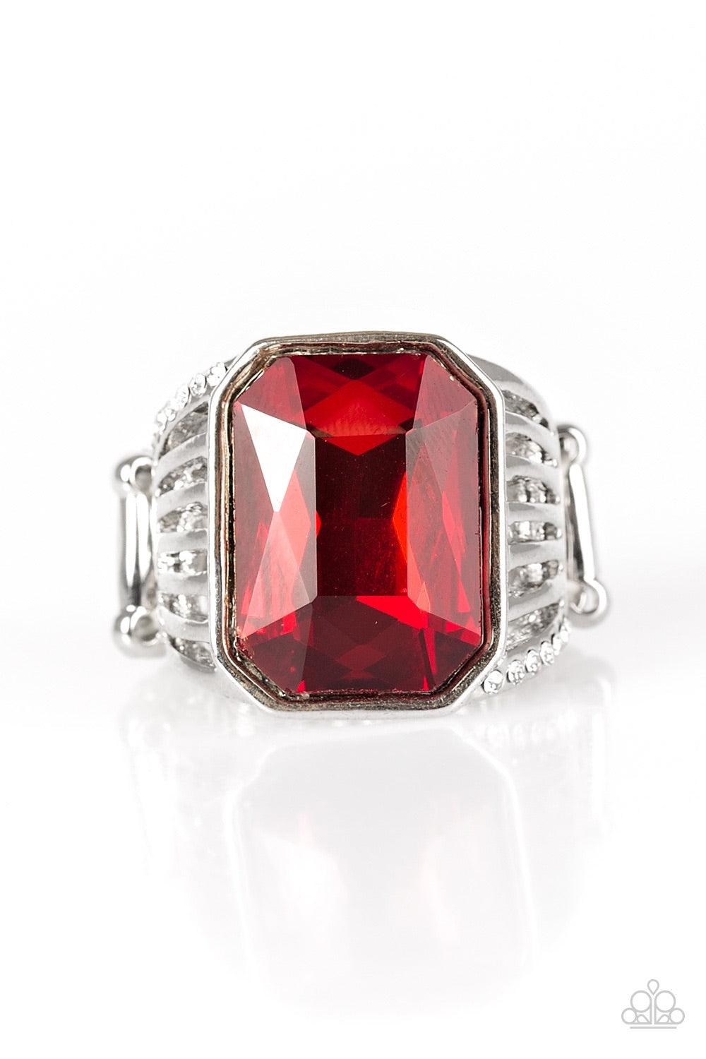 Paparazzi Accessories Make Way For The Champ - Red Featuring a regal emerald style cut, a faceted red gem is pressed into an airy band, creating a champion shimmer. Features a stretchy band for a flexible fit. Jewelry