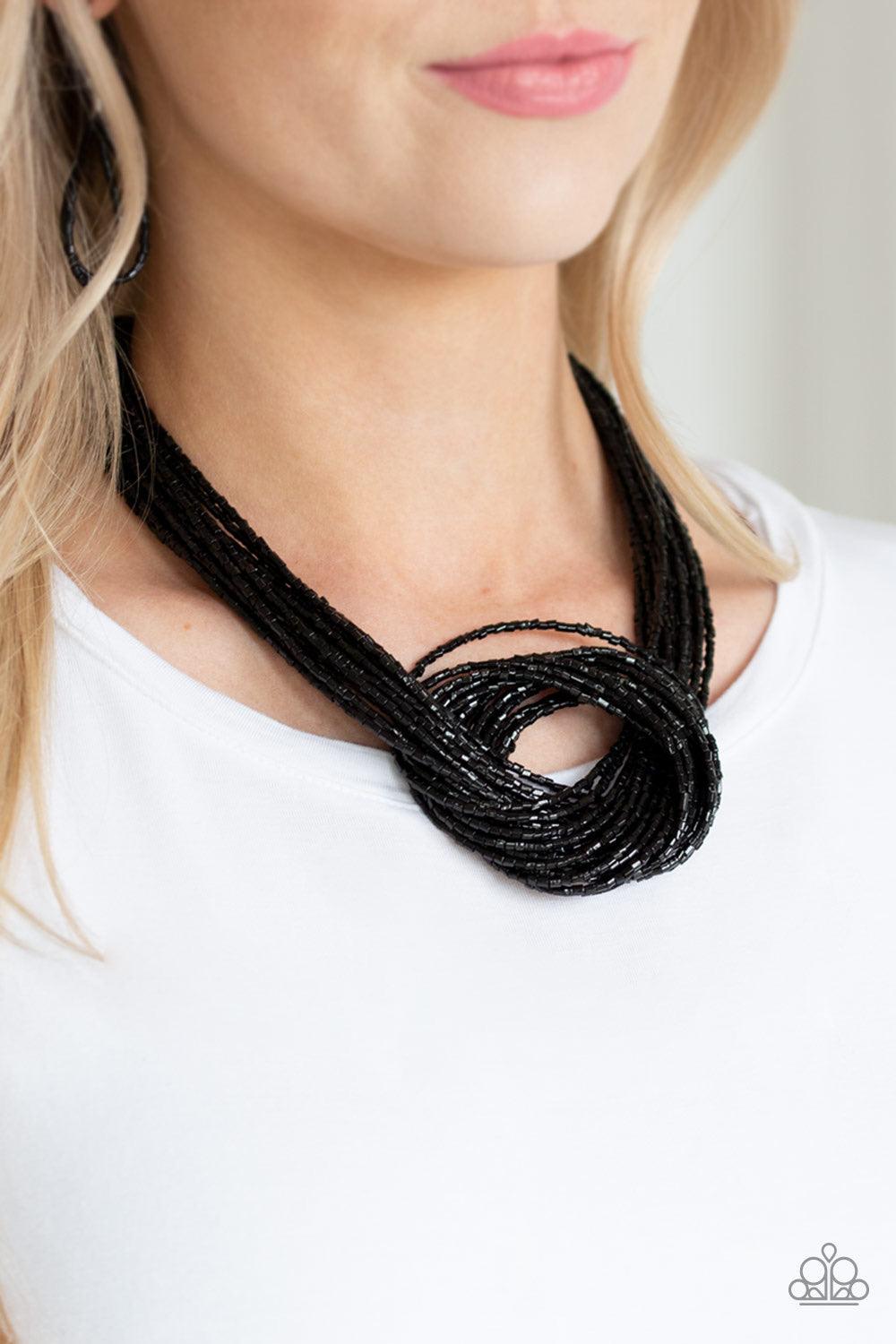 Paparazzi Accessories Knotted Knockout - Black Countless strands of glistening black seed beads delicately knot together below the collar to create an unforgettable statement piece. Features an adjustable clasp closure. Jewelry