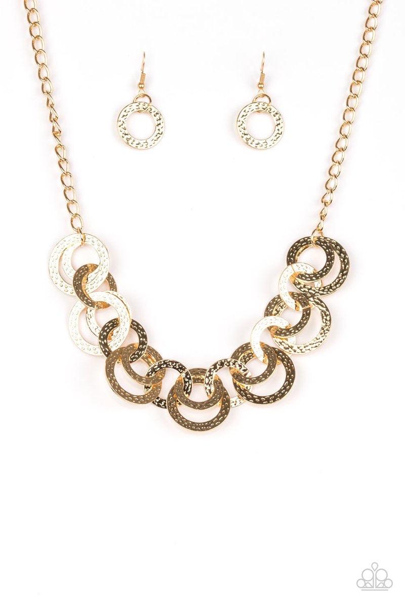 Paparazzi Accessories Treasure Tease - Gold Brushed in a high-sheen shimmer, delicately hammered gold discs connect below the collar for a bold industrial look. Features an adjustable clasp closure. Jewelry