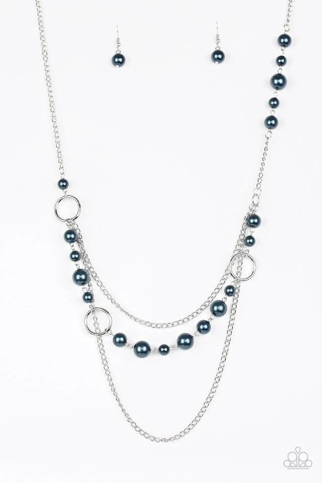 Paparazzi Accessories Party Dress Princess - Blue Pearly blue beads and shimmery silver hoops trickle along glistening silver chains, creating mismatched layers down the chest. Features an adjustable clasp closure. Jewelry