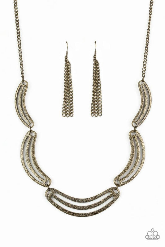 Paparazzi Accessories Palm Springs Pharaoh - Brass Hammered in an antiqued shimmer, airy half-moon shaped brass frames link below the collar in a bold, statement-making fashion. Features an adjustable clasp closure. Jewelry