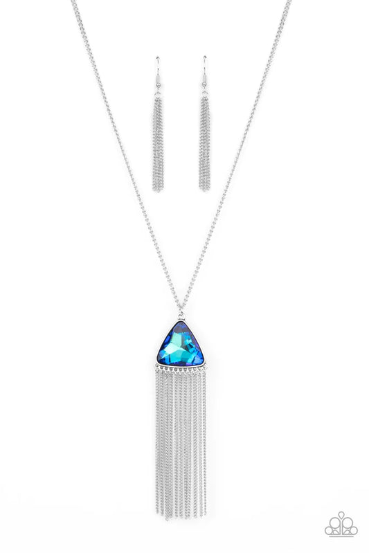 Paparazzi Accessories Proudly Prismatic - Blue Featuring an iridescent UV shimmer, an oversized blue triangular gem swings from the bottom of a lengthened silver chain. A curtain of silver chains streams out from the bottom of the sparkly pendant, adding