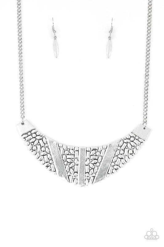 Paparazzi Accessories Terra Trailbreaker - Silver Varying in shape, a collection of dainty silver frames coalesce into a striking crescent pendant below the collar for a statement making look. Features an adjustable clasp closure. Sold as one individual n