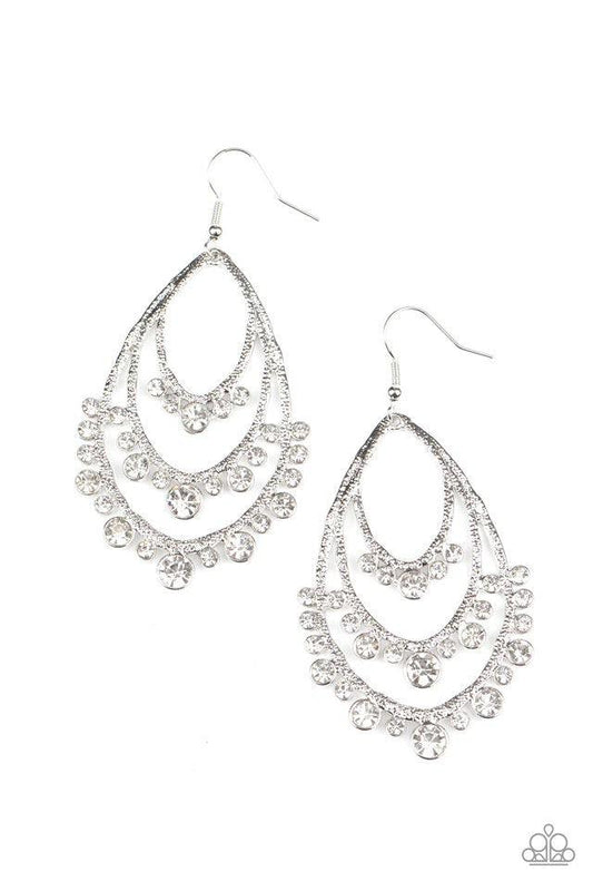 Paparazzi Accessories Break Out In TIERS - White A gorgeous collection of glassy white rhinestones drip from the bottom of a tiered silver frame, coalescing into a dazzling statement piece. Earring attaches to a standard fishhook fitting. Sold as one pair