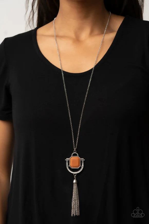 Paparazzi Accessories Funky Fringe - Brown A faceted geometric Adobe bead is pressed into a stacked southwestern inspired silver frame at the bottom of an extended silver chain. A shimmery silver chain tassel swings from the bottom of the display, adding