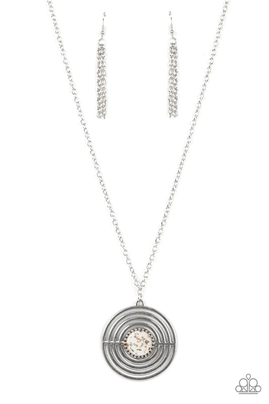 Paparazzi Accessories Targeted Tranquility - White Flecked in iridescent shell-like accents, a studded white frame adorns the center of an oversized silver pendant rippling with concentric circles at the bottom of an extended silver chain for a dizzying p