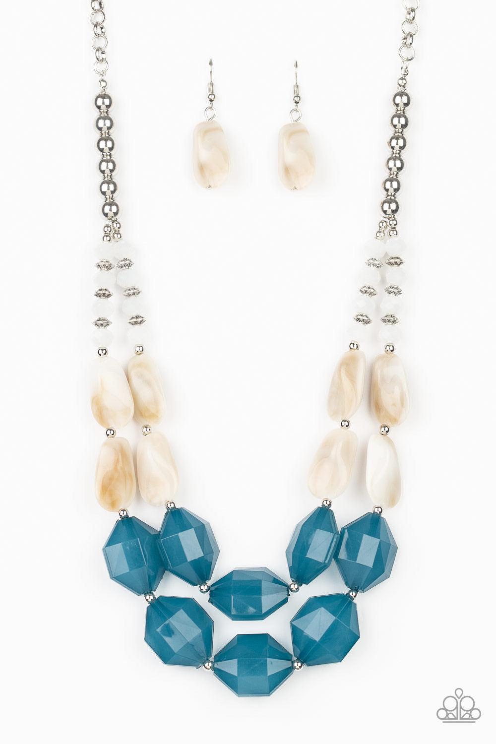 Paparazzi Accessories Seacoast Sunset - Blue A whimsical collection of silver, opaque crystal-like, cloudy white, and faceted blue beads are threaded along invisible wires, creating statement-making layers below the collar. Features an adjustable clasp cl