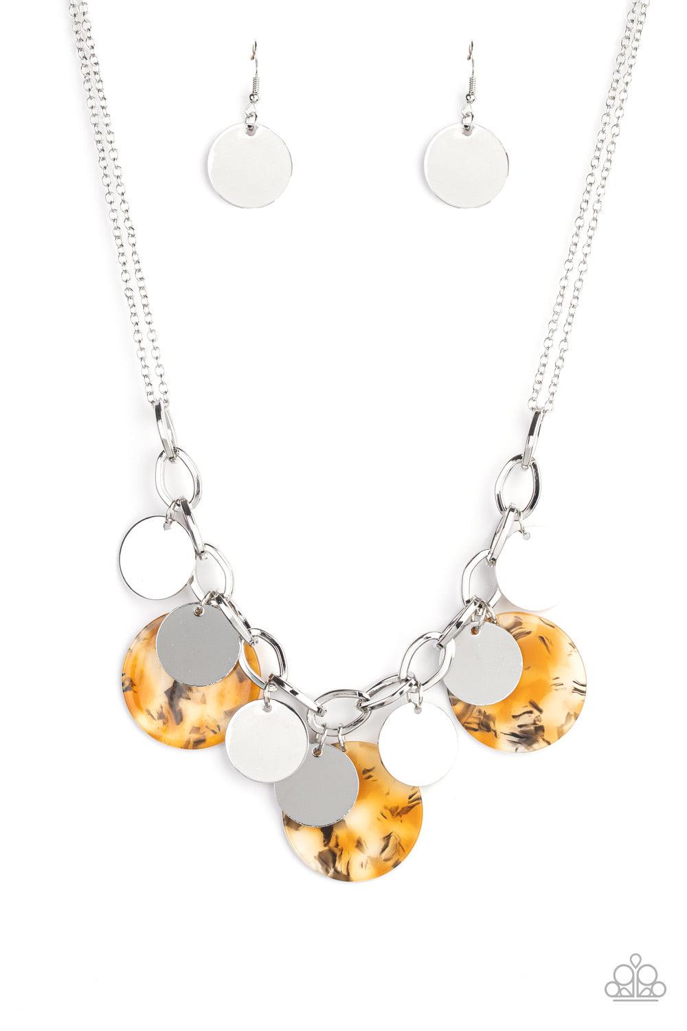 Paparazzi Accessories Confetti Confection - Yellow Attached to doubled silver chain, a playful collection of colorful acrylic discs and shiny silver discs swing from the bottom of a bold silver chain, creating a bubbly fringe below the collar. Features an