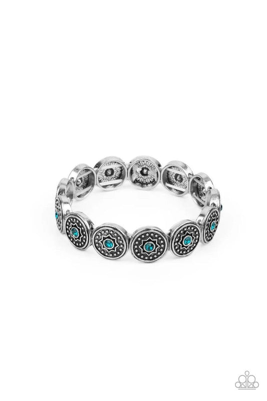 Paparazzi Accessories Colorfully Celestial - Blue Dotted with glittery blue rhinestones, a collection of antiqued studded silver frames are embossed in star accents as they are threaded along stretchy bands around the wrist for a stellar fashion. Sold as