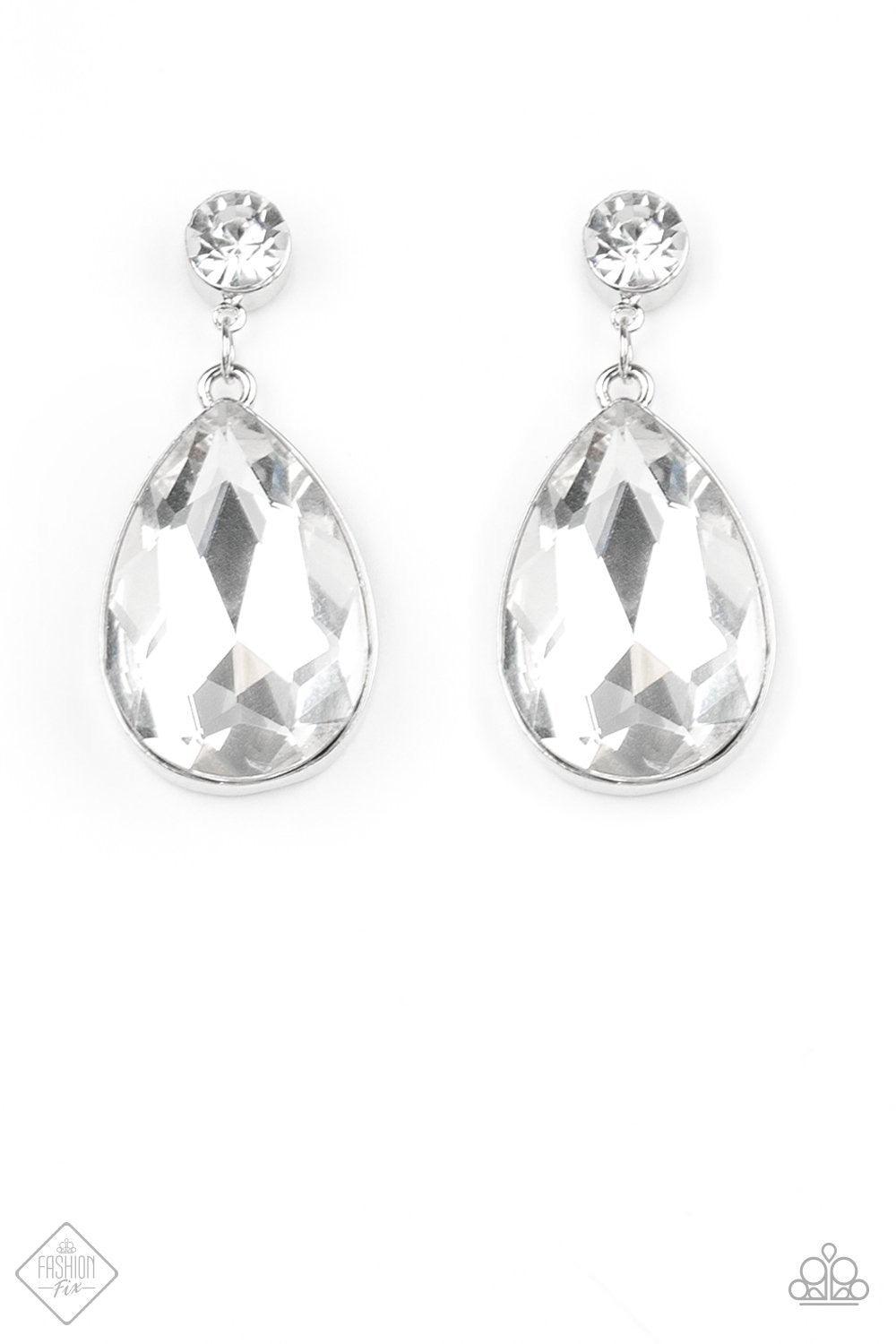 Paparazzi Accessories Debutante Dazzle - White An exaggerated teardrop-shaped rhinestone swings from the bottom of a classic white rhinestone, creating a dramatically glamorous lure. Earring attaches to a standard post fitting Jewelry
