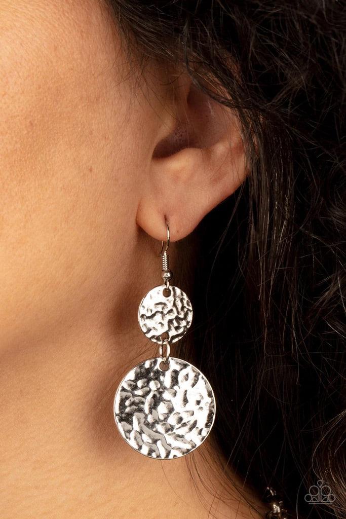 Paparazzi Accessories Grounded Glamour - Blue An earthy collection of hammered silver discs, turquoise stone accents, and bold silver hoops link with sections of chunky and mismatched silver chains across the chest, creating a seasonal display. Features a