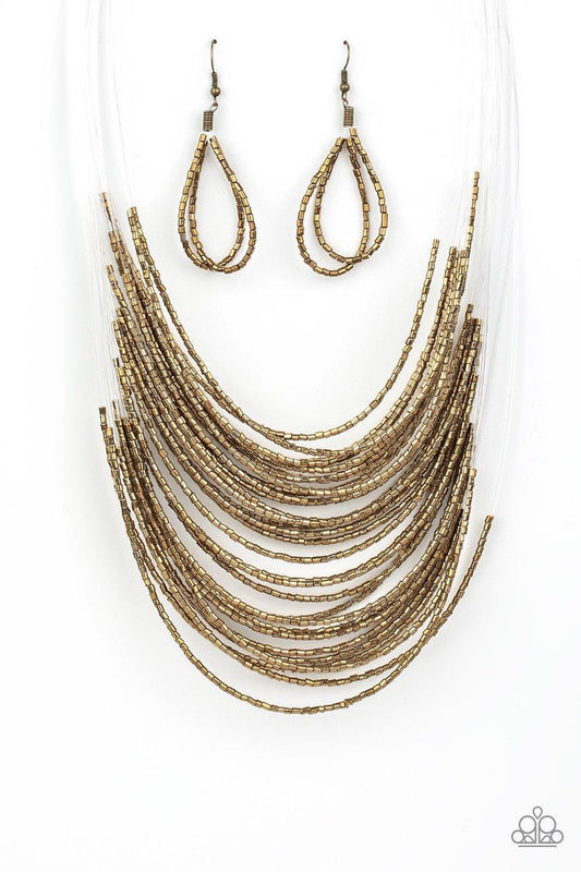 Paparazzi Accessories Catwalk Queen - Brass Strand after strand of shimmering brass seed beads fall together to create a bold statement piece. Features an adjustable clasp closure. Sold as one individual necklace. Includes one pair of matching earrings. J