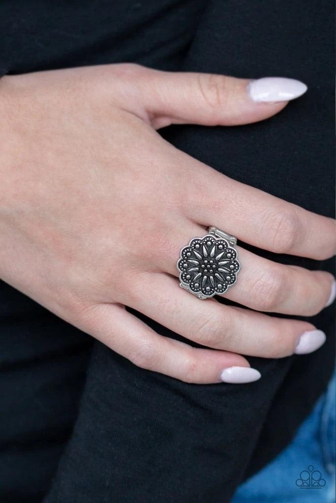 Paparazzi Accessories Desert Sunflower - Silver Embossed in a rustic wildflower pattern, a silver floral frame dots the top of the finger for a whimsical look. Features a stretchy band for a flexible fit. Sold as one individual ring. Jewelry