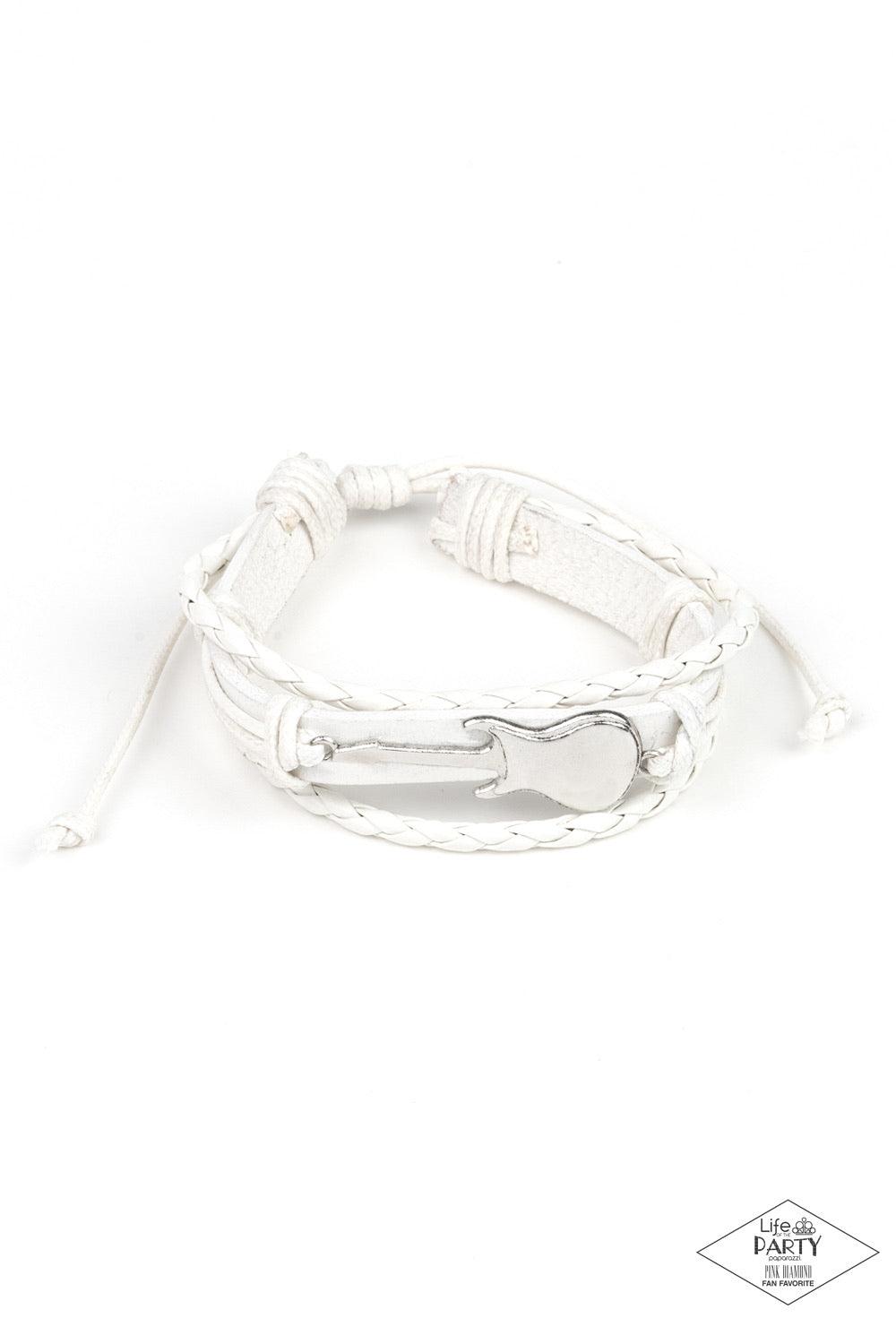 Paparazzi Accessories Lead Guitar ~White Two strands of braided leather cording join a rustic white leather band around the wrist. Shiny white cording wraps around a metallic guitar charm, knotting the centerpiece in place for an urban finish. Features an