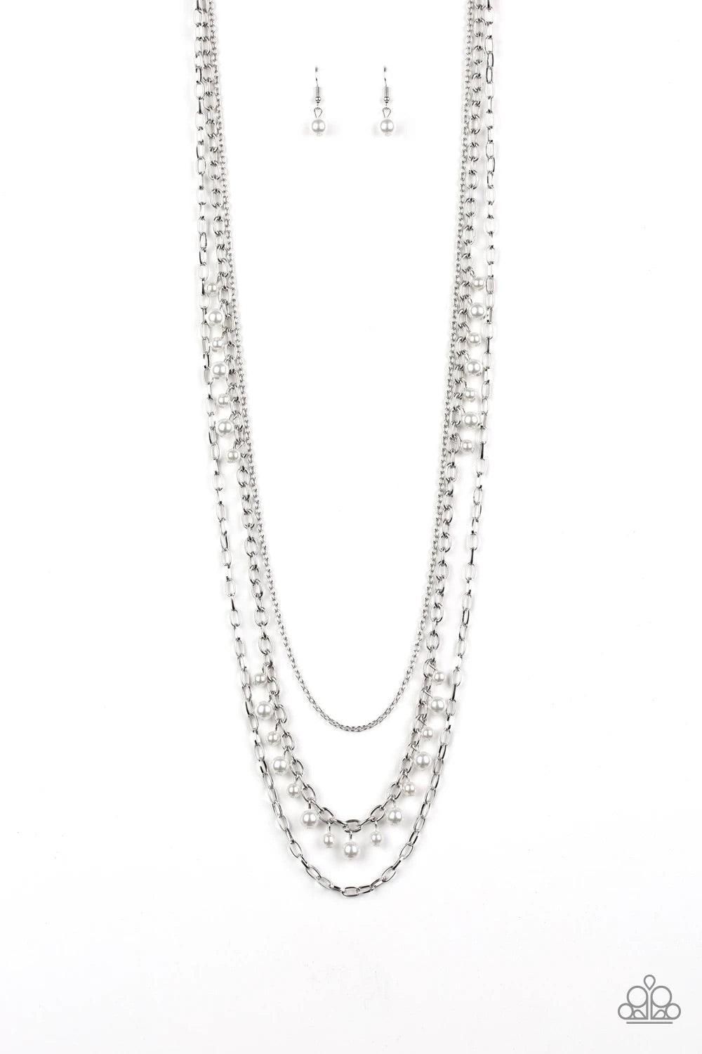 Paparazzi Accessories Pearl Pageant None - White Three mismatched silver chains layer down the chest. Dainty gray pearls cascade down one silver chain, adding a flirty twist to the timeless pearl palette. Features an adjustable clasp closure. Sold as one