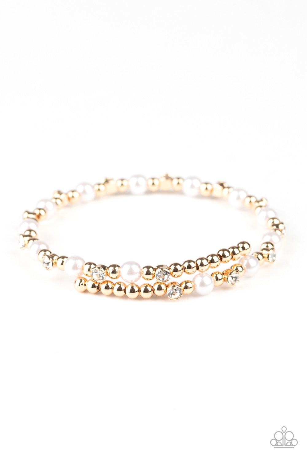 Paparazzi Accessories Decadently Dainty -Gold A collection of shiny gold beads, white pearls, and dainty white rhinestones are threaded along a dainty wire around the wrist for a timeless look. Sold as one individual bracelet. Jewelry