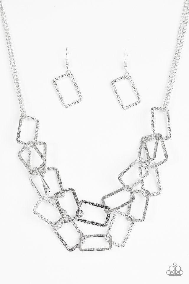 Paparazzi Accessories Seattle Scene - Silver Delicately hammered in light-catching shimmer, rows of glistening rectangular frames link below the collar for a bold industrial style. Features an adjustable clasp closure. Sold as one individual necklace. Inc