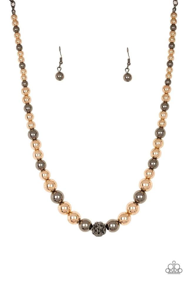 Paparazzi Accessories High Stakes FAME - Multi Gradually increasing in size near the center, glistening gold and gunmetal beads are threaded along an invisible wire below the collar. Encrusted in smoky rhinestones, a sparkling gunmetal bead adorns the cen
