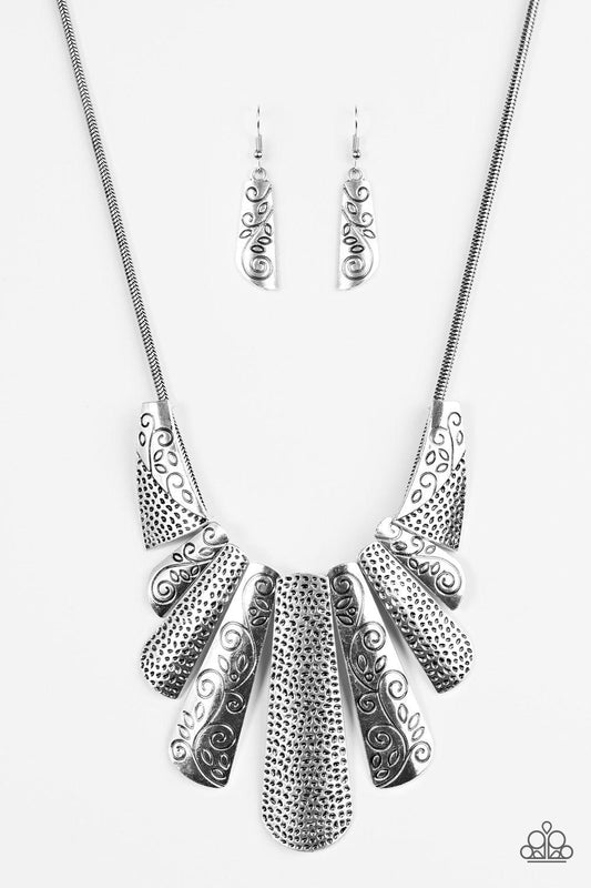 Paparazzi Accessories Untamed - Silver Silver plates featuring various hammered and filigreed textures fan out across the chest along a thick silver snake chain. The gorgeous tribal design falls gracefully below the collar into a dramatic statement piece.