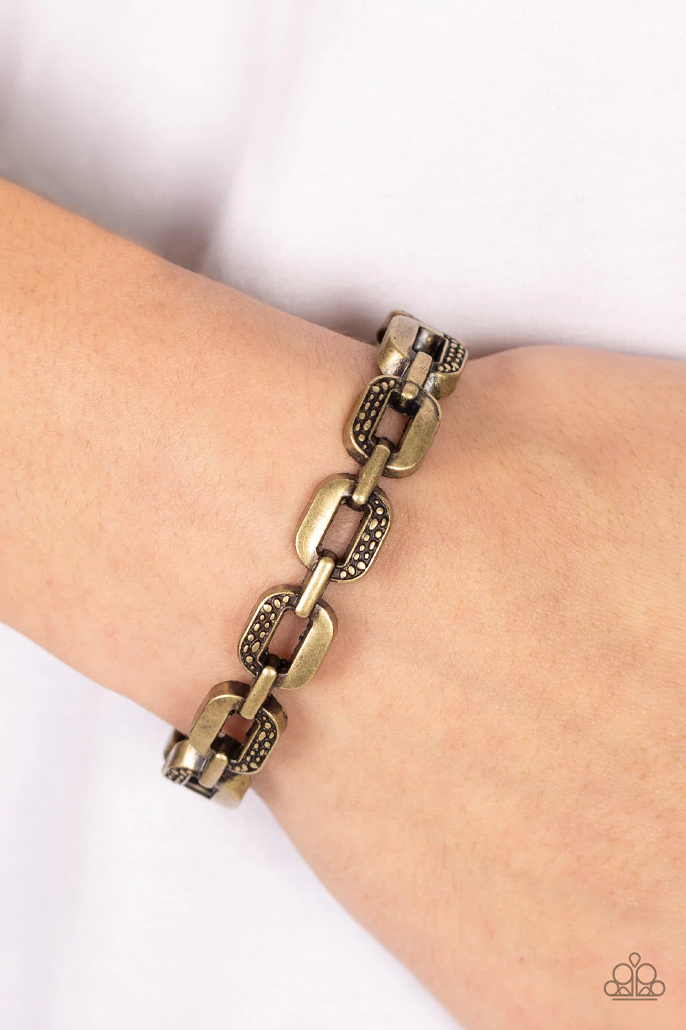 Paparazzi Accessories Powerhouse Plunder - Brass Alternating in sections of rustic dotted texture, an oversized collection of brass chain links interlock into a solid bangle-like bracelet around the wrist. Features a hinged closure. Sold as one individual