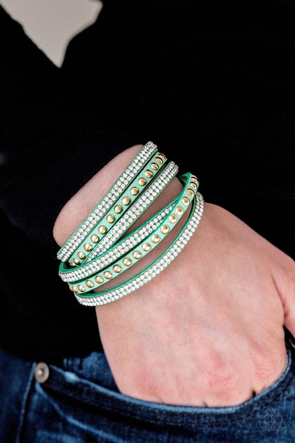 Paparazzi Accessories I Bold You So! - Blue Rows of glassy white rhinestones and glistening gold studs are pressed along three strands of minty green suede for a sassy look. The elongated band allows for a trendy double wrap design. Features an adjustable