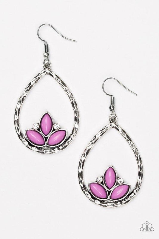 Paparazzi Accessories Lotus Laguna - Purple Shiny purple beads adorn the bottom of a hammered silver teardrop, coalescing into a whimsical lotus pattern. Dainty white rhinestones flank the shiny beads for a refined finish. Earring attaches to a standard f