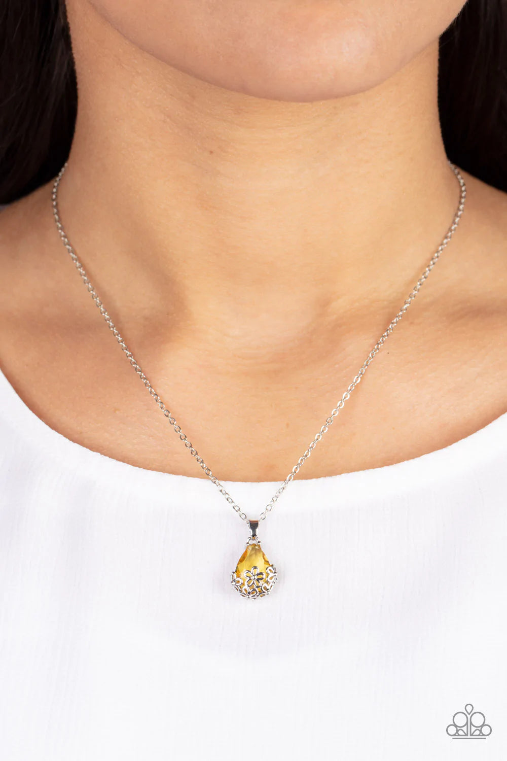 Paparazzi Accessories Flower Patch Fabulous - Yellow Dainty silver flowers adorn the bottom of a sparkly yellow teardrop gem at the bottom of a dainty silver chain, creating a prismatic pendant below the collar. Features an adjustable clasp closure. Sold