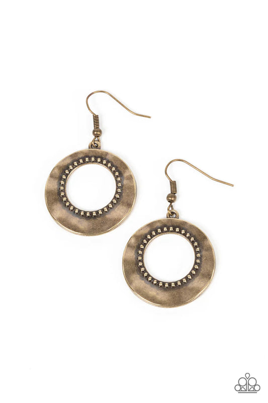 Paparazzi Accessories Desert Diversity - Brass Brushed in a burnished finish, a warped brass disc ripples around a studded brass center for a rustic flair. Earring attaches to a standard fishhook fitting. Sold as one pair of earrings. Jewelry