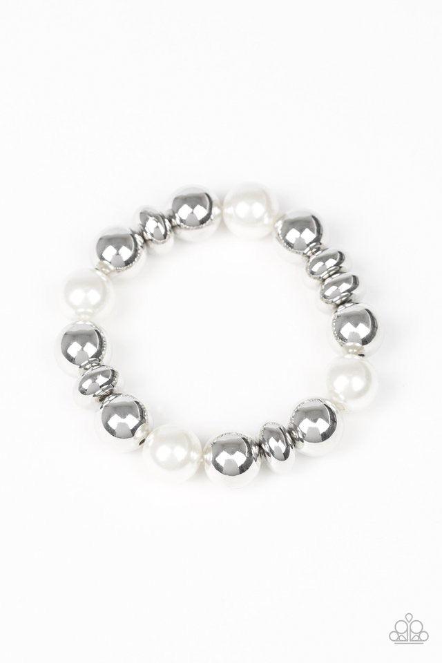 Paparazzi Accessories Upper Manhattan ~White A collection of shiny silver beads and pearly white beads are threaded along a stretchy band around the wrist for a refined look.