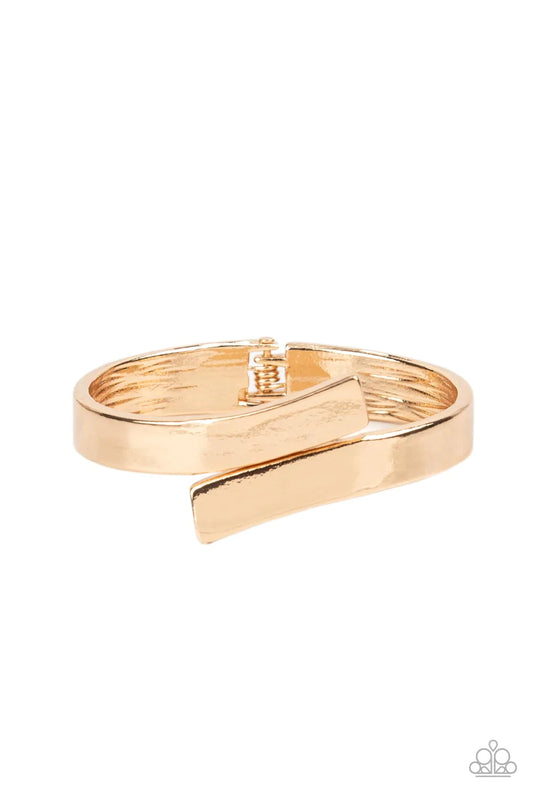 Paparazzi Accessories Dare To Flare - Gold Two oversized gold ribbons delicately overlap across the center of the wrist, creating a stylish and stackable bangle-like cuff. Features a hinged closure. Sold as one individual bracelet.