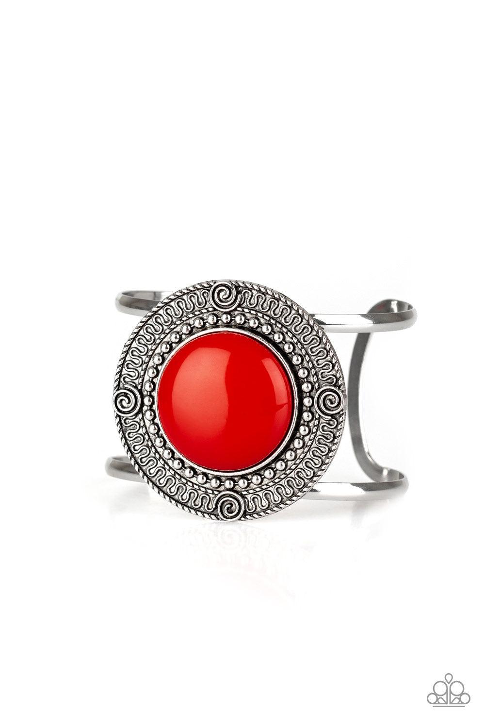 Paparazzi Accessories Tribal Pop - Red An oversized red bead is pressed into the center of a round silver frame radiating with swirly filigree detail. The bold frame sits atop an airy silver cuff for a vibrant pop of color. Jewelry