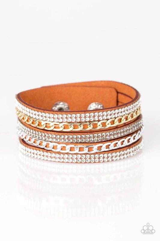 Paparazzi Accessories Fashion Fiend - Orange Glassy white and smoky rhinestones are encrusted along strands of orange suede. Glistening silver and gold chains are added to the bands, adding edgy industrial shimmer to the sassy palette. Features an adjusta